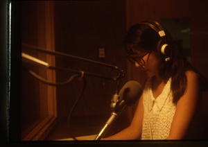 1987 WRSU Orientation Slide Show<br/>Ellie Yung in Announce Booth 1<br>Slide #05