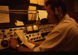 1987 WRSU Orientation Slide Show<br/>Reading an Accouncement<br>Slide #34_1