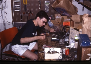 1987 WRSU Orientation Slide Show<br/>Soldering on the Tech Bench<br>Mike Reed<br>Slide #38