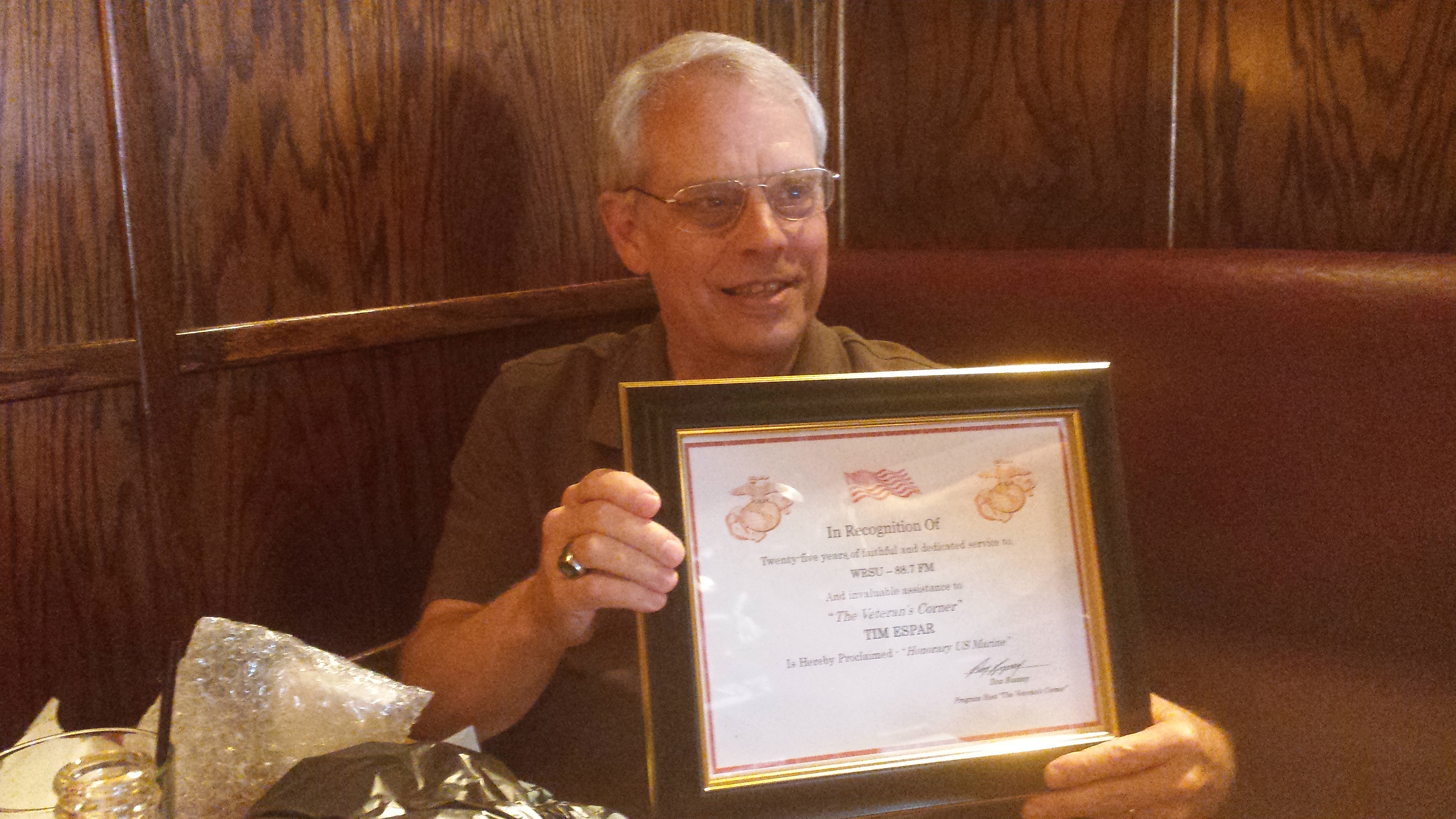 2014 - Former Broadcast Administrator Tim Espar recieving a plaque at a luncheon for 25 year of service to WRSU