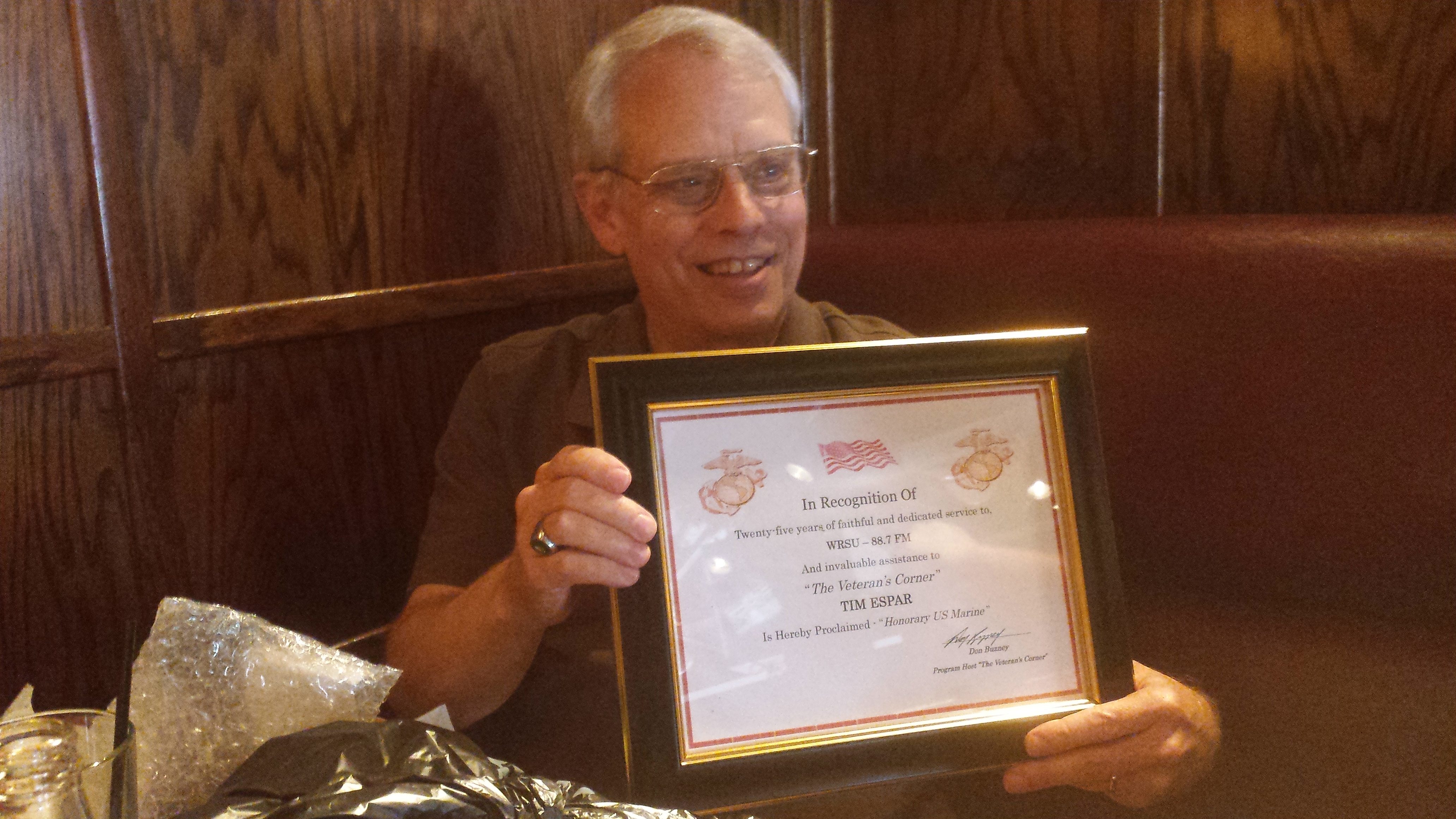 2014 - Former Broadcast Administrator Tim Espar recieving a plaque at a luncheon for 25 year of service to WRSU